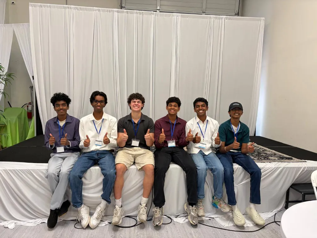 Six members of the AIXellerate host team sitting together after the event.